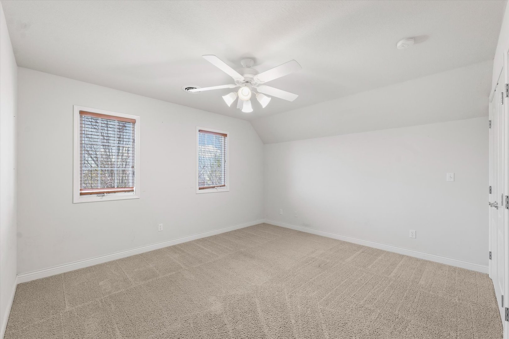 1818 Benodot Street Champaign, IL 61822 - Photo 23 of 41 an empty room with windows and fan