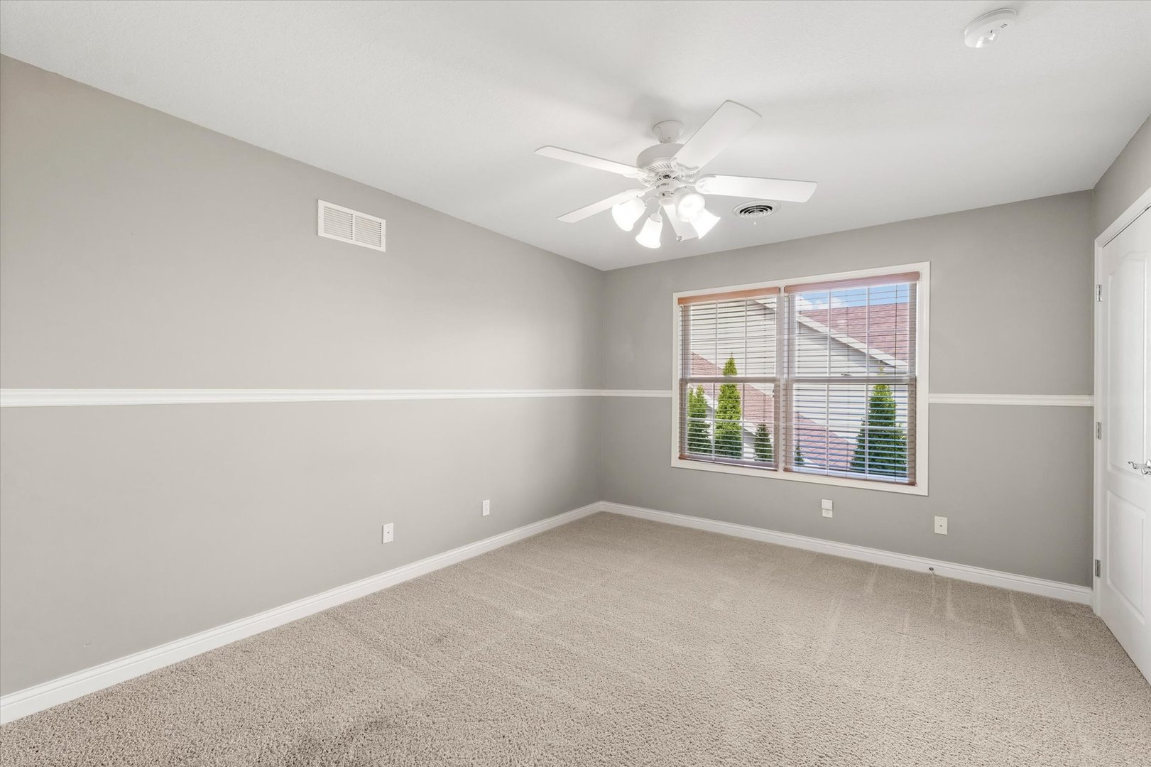 1818 Benodot Street Champaign, IL 61822 - Photo 25 of 41 an empty room with a window and a fan