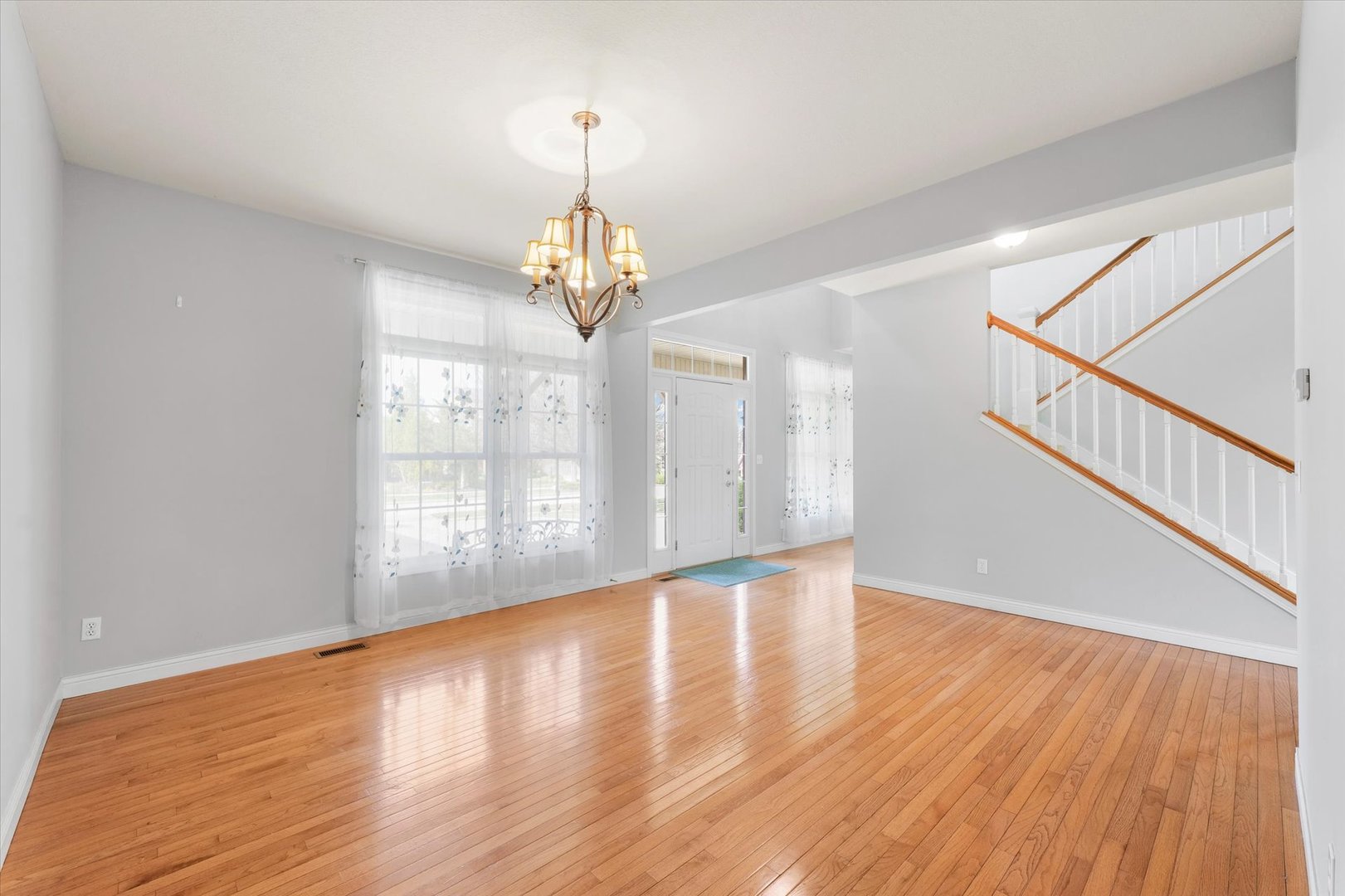 1818 Benodot Street Champaign, IL 61822 - Photo 7 of 41 a view of wooden floor and staircase in a room