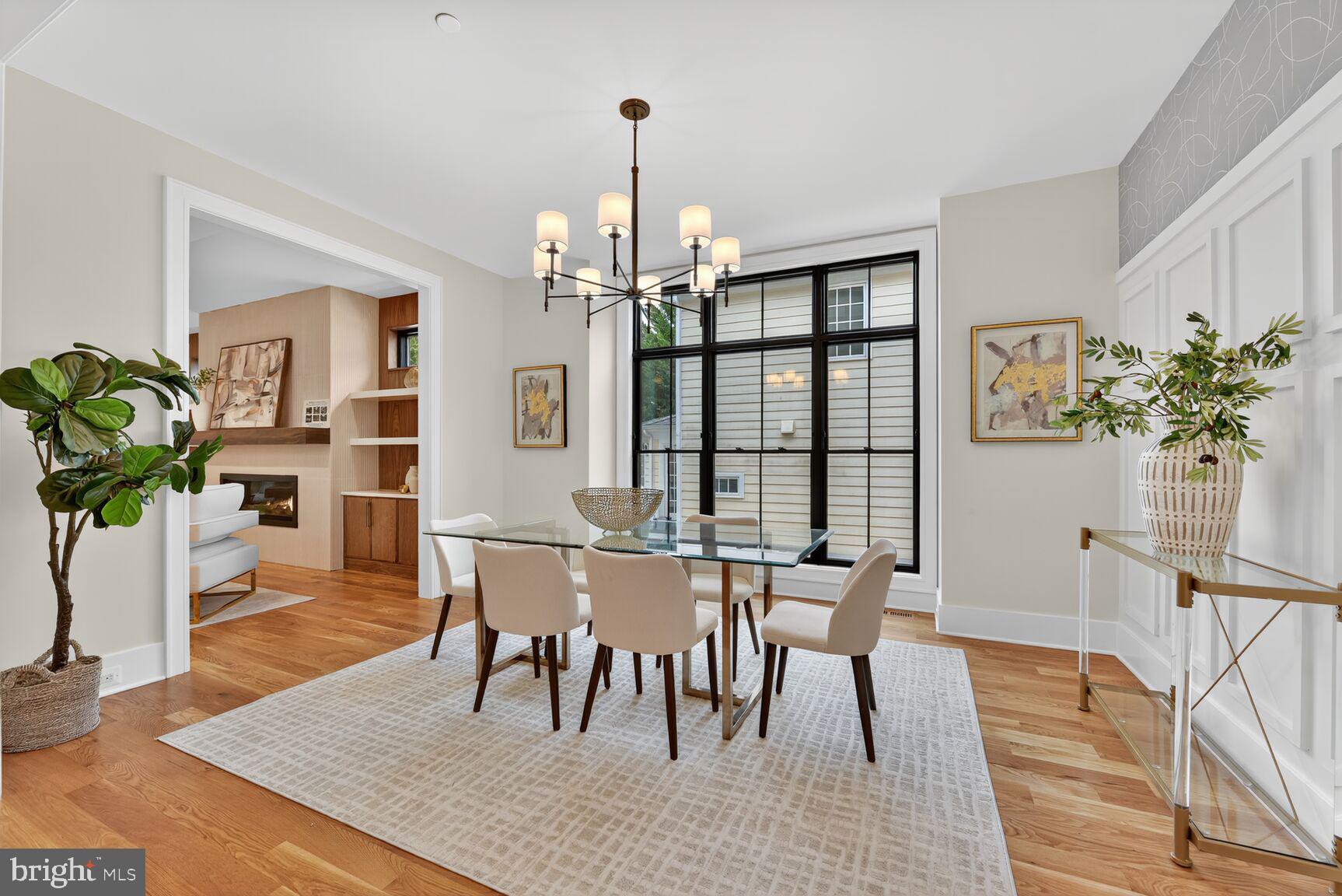 4812 Chevy Chase Boulevard Chevy Chase, MD 20815 - Photo 11 of 32 a view of a dining room with furniture window and wooden floor