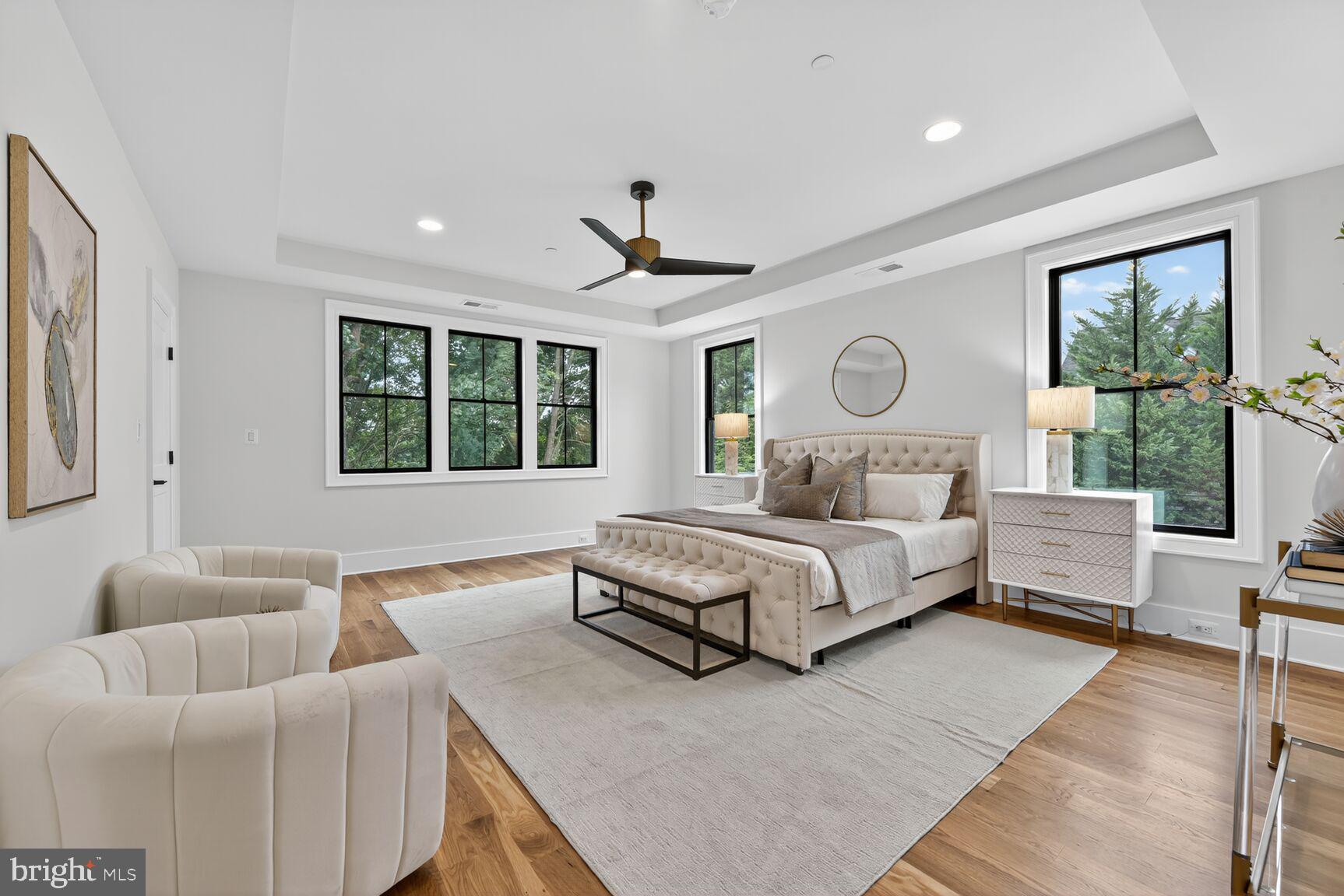 4812 Chevy Chase Boulevard Chevy Chase, MD 20815 - Photo 13 of 32 a spacious bedroom with a bed couch and window