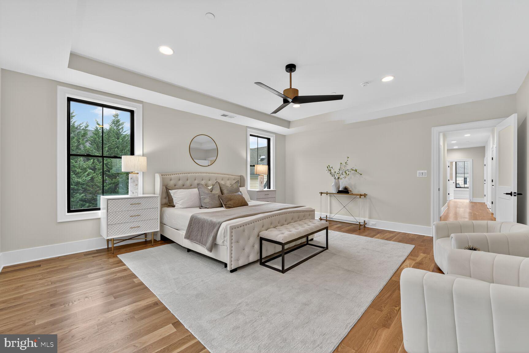 4812 Chevy Chase Boulevard Chevy Chase, MD 20815 - Photo 14 of 32 a spacious bedroom with a large bed and a window