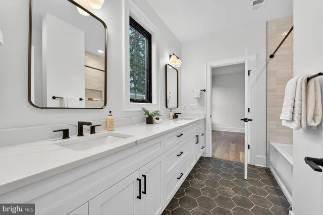 a kitchen with stainless steel appliances granite countertop a sink and a wooden cabinets