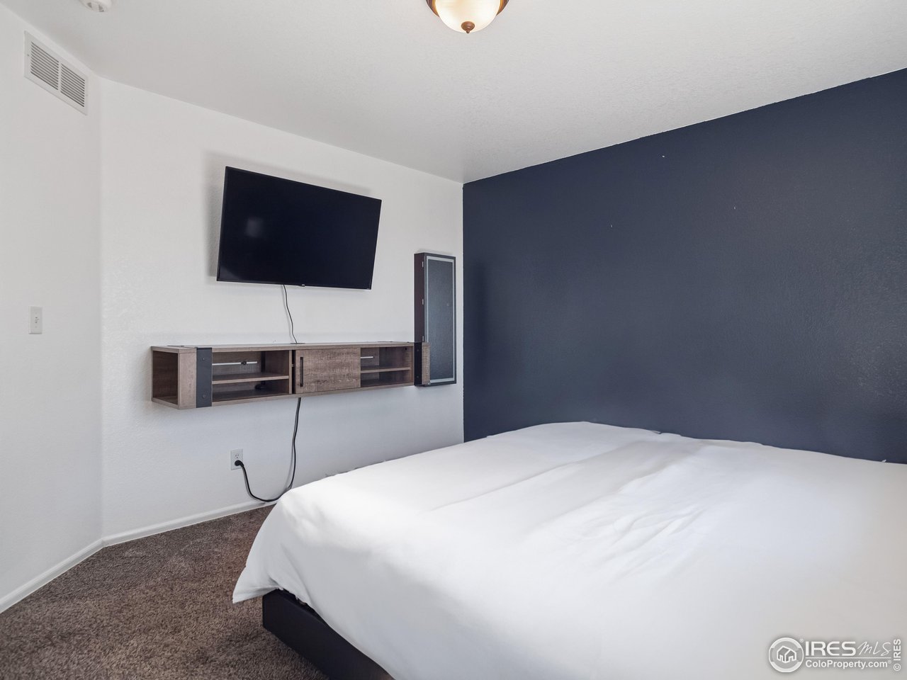 4050 West 30th Street Road Greeley, CO 80634 - Photo 13 of 37 Floating entertainment center for added storage and modern flare