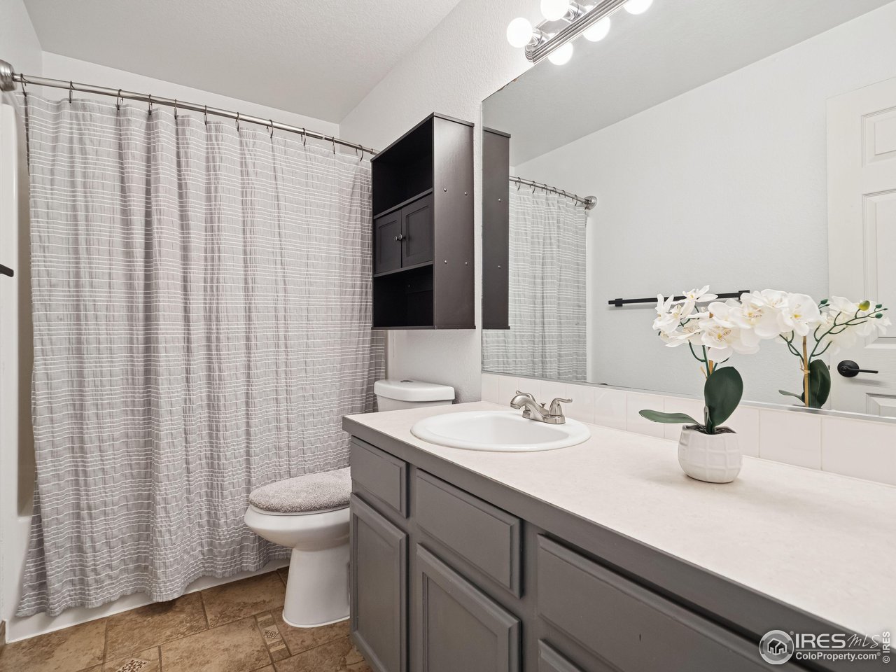 4050 West 30th Street Road Greeley, CO 80634 - Photo 16 of 37 Upstairs bathroom, bright and clean!