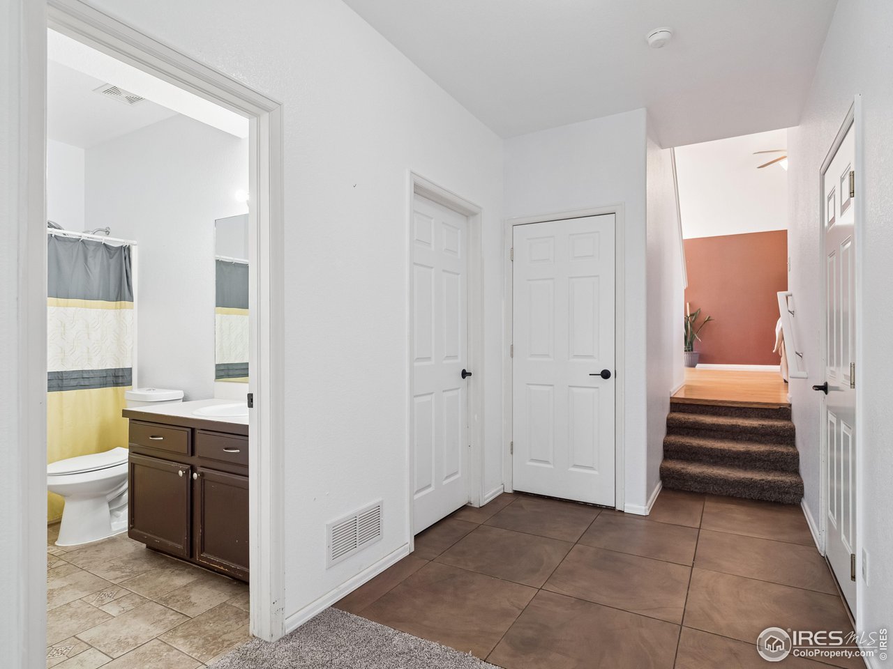 4050 West 30th Street Road Greeley, CO 80634 - Photo 27 of 37 Lower level hall with laundry room and garage access