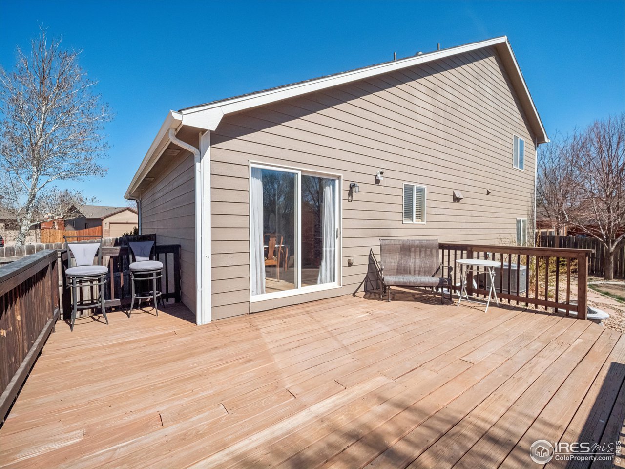 4050 West 30th Street Road Greeley, CO 80634 - Photo 29 of 37 Nice wood deck for eating while watching the sunset or relaxing under the stars