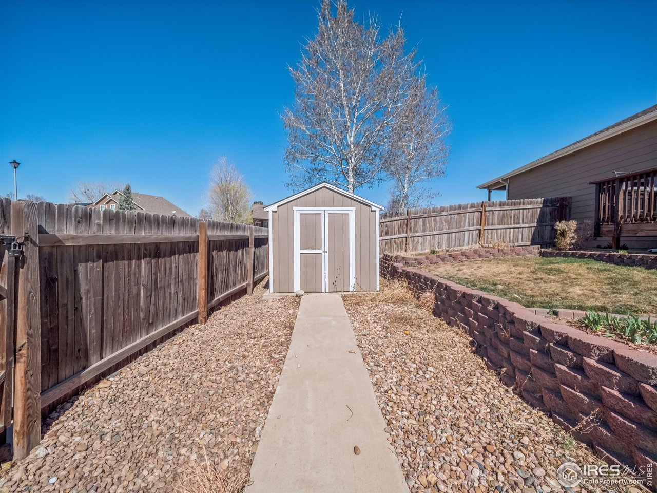 4050 West 30th Street Road Greeley, CO 80634 - Photo 34 of 37 Solid retaining walls in backyard