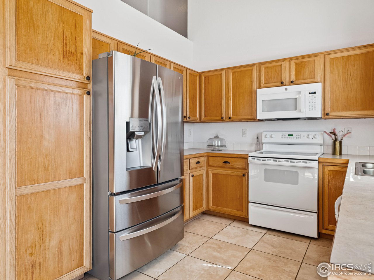 4050 West 30th Street Road Greeley, CO 80634 - Photo 8 of 37 Travertine tile in kitchen