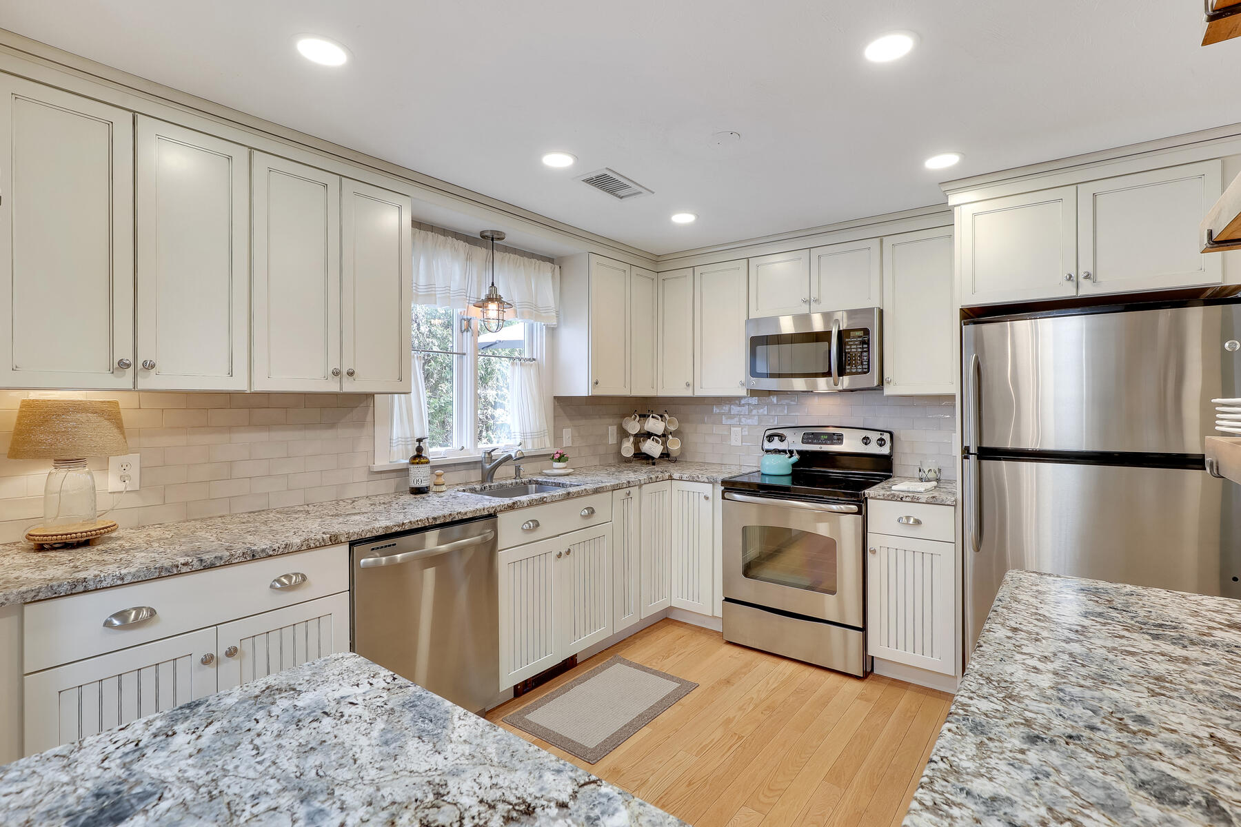 53 Kelley Road West Harwich, MA 02671 - Photo 11 of 43 a kitchen with kitchen island granite countertop a sink appliances cabinets and counter space