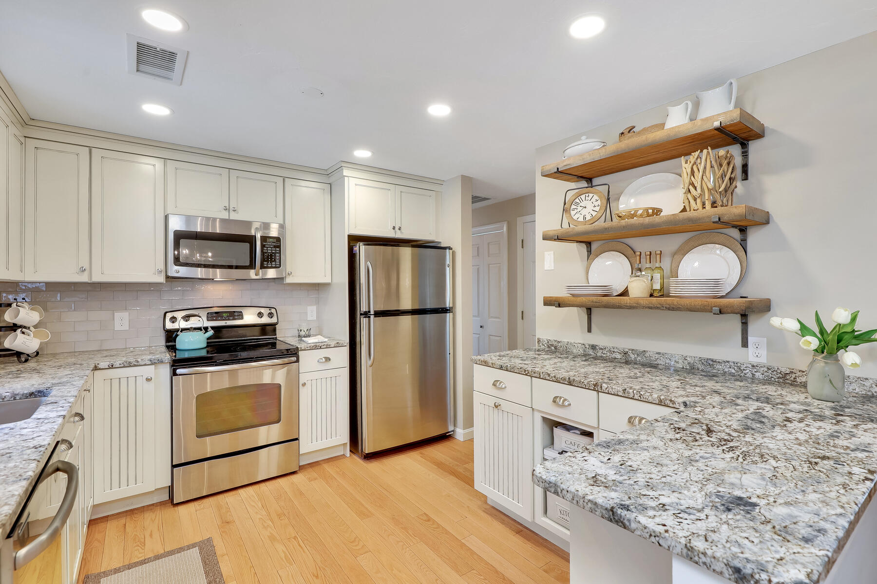 53 Kelley Road West Harwich, MA 02671 - Photo 12 of 43 a kitchen with stainless steel appliances granite countertop a stove a sink and a refrigerator