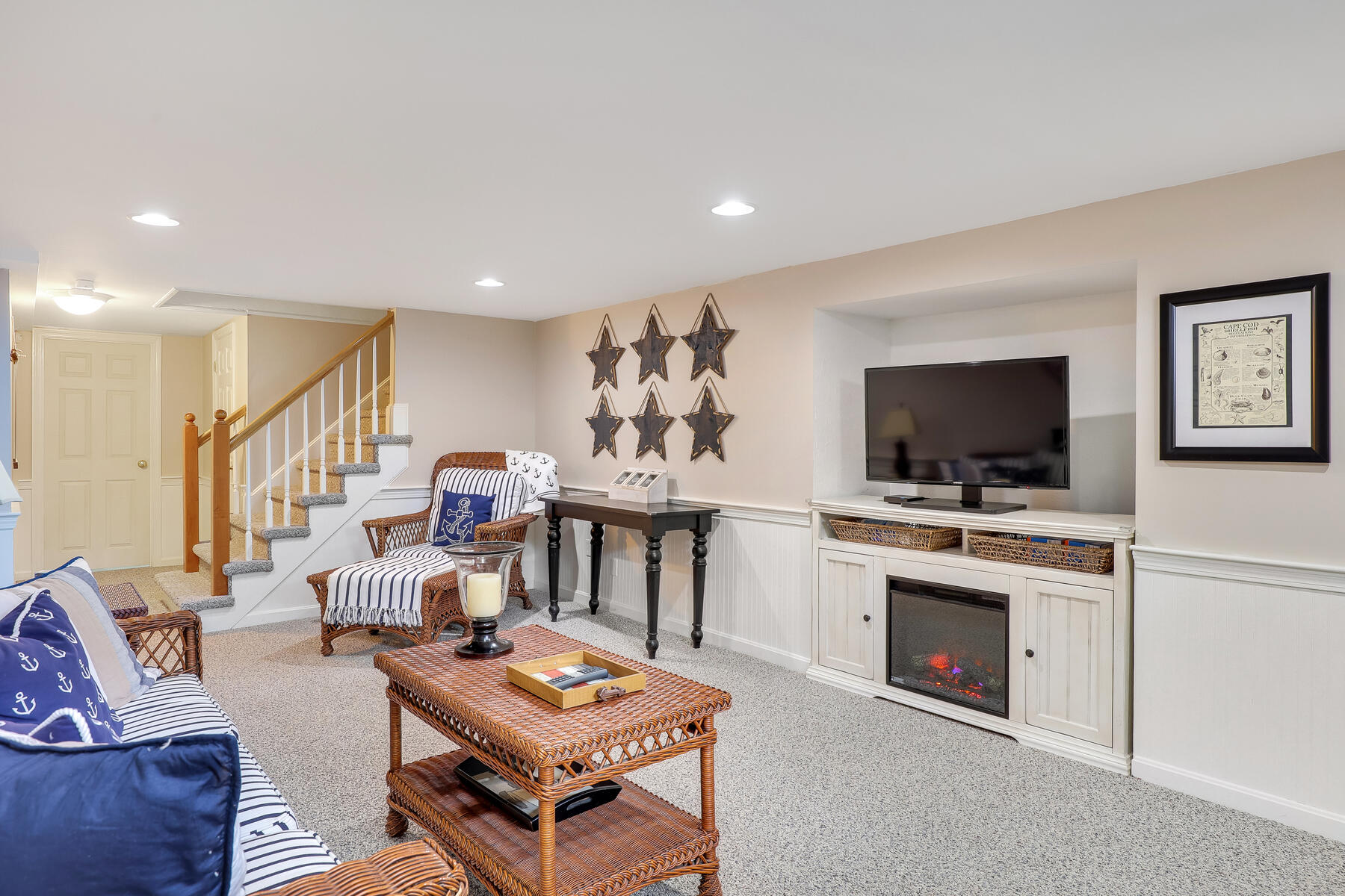 53 Kelley Road West Harwich, MA 02671 - Photo 29 of 43 a living room with furniture a flat screen tv and a fireplace