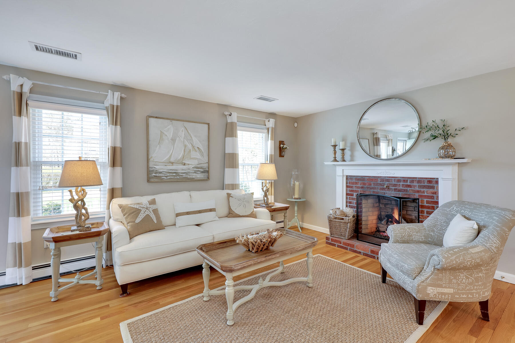 53 Kelley Road West Harwich, MA 02671 - Photo 6 of 43 a living room with furniture a fireplace and a large window