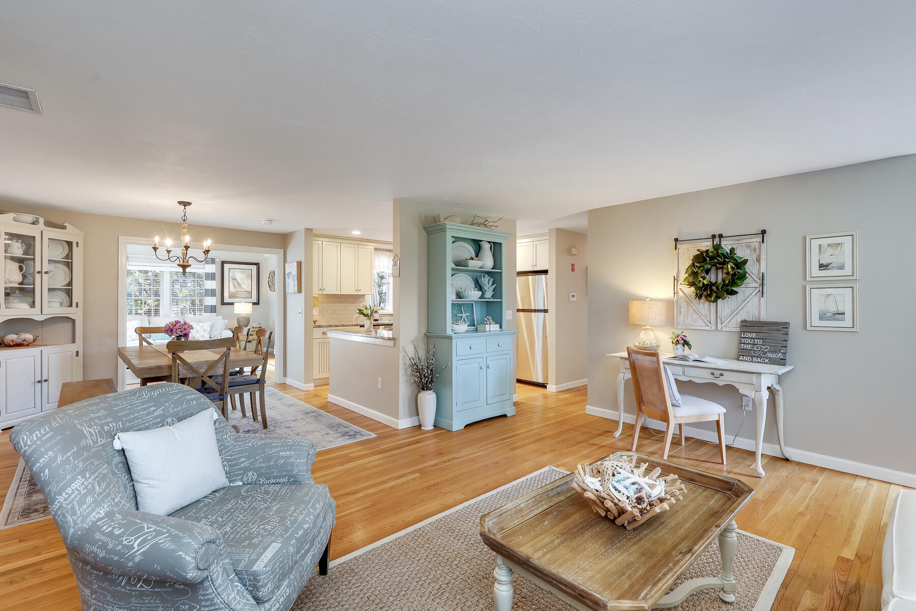53 Kelley Road West Harwich, MA 02671 - Photo 10 of 43 a living room with furniture and a dining table with wooden floor