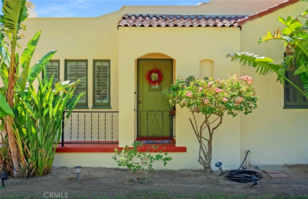 4374 Highland Place Riverside, CA 92506 - Photo 1 of 1 a front view of a house with garden