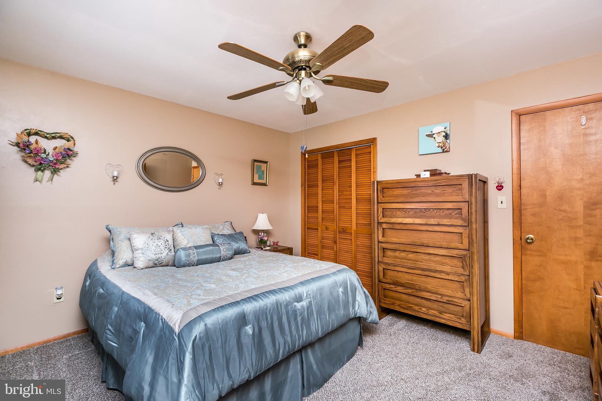 2507 Maple Road Baltimore, MD 21219 - Photo 11 of 29 a bedroom with a bed and ceiling fan