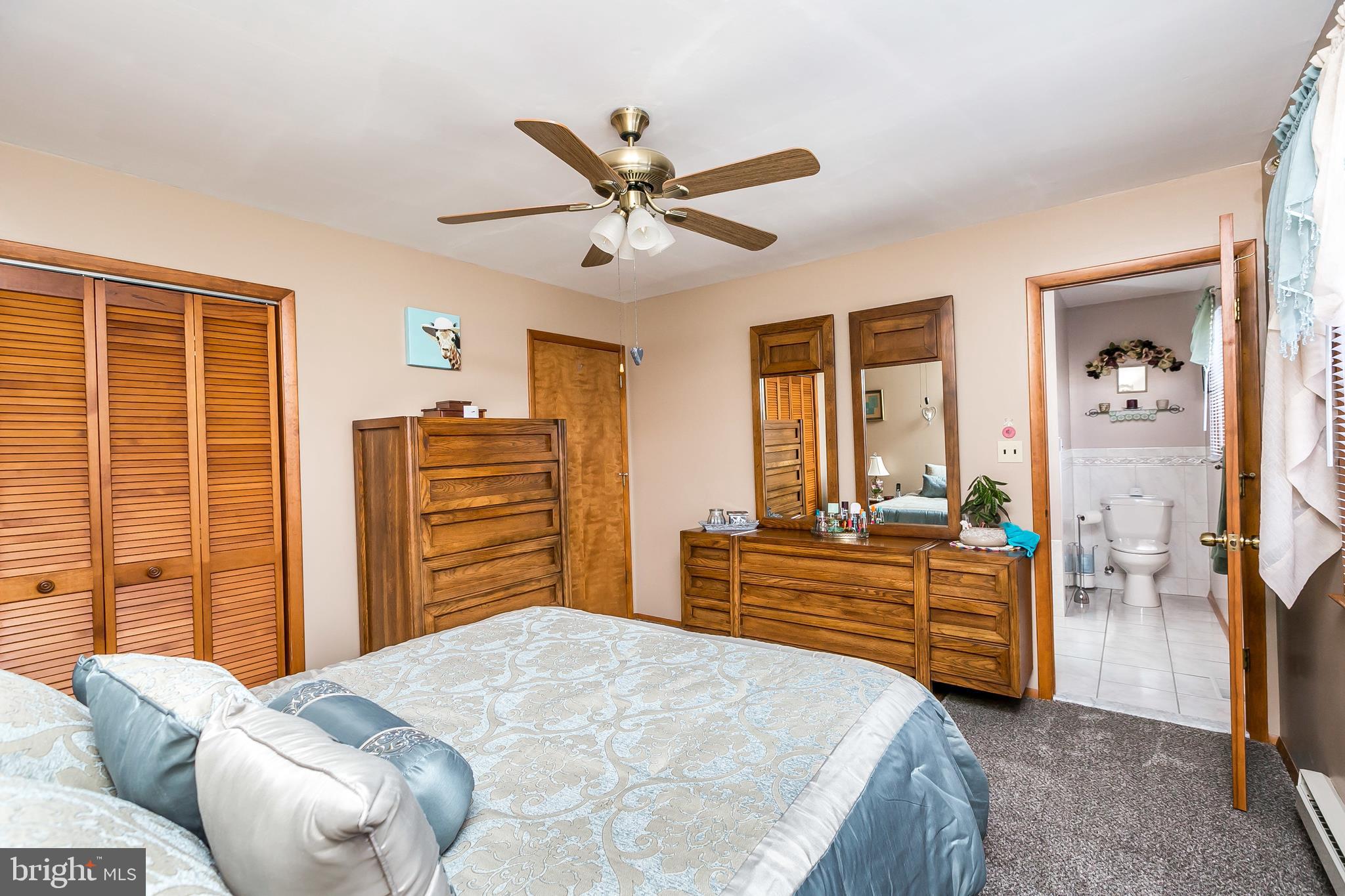 2507 Maple Road Baltimore, MD 21219 - Photo 12 of 29 a bedroom with a bed dresser and a window