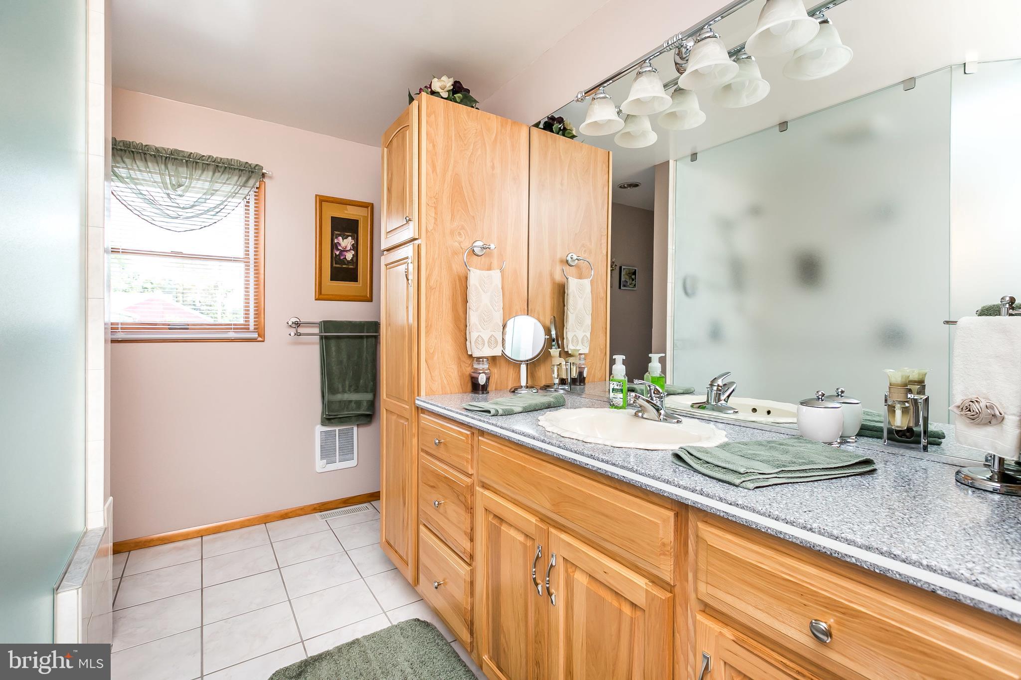 2507 Maple Road Baltimore, MD 21219 - Photo 13 of 29 a spacious bathroom with a double vanity sink mirror and double