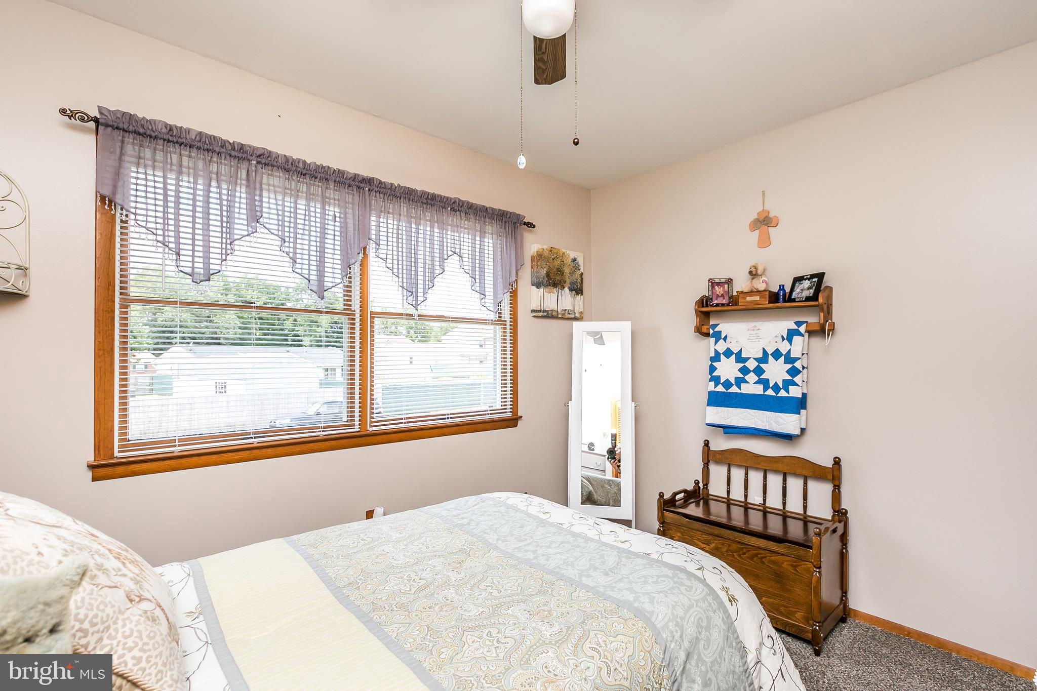 2507 Maple Road Baltimore, MD 21219 - Photo 17 of 29 a bedroom with a bed and a large window