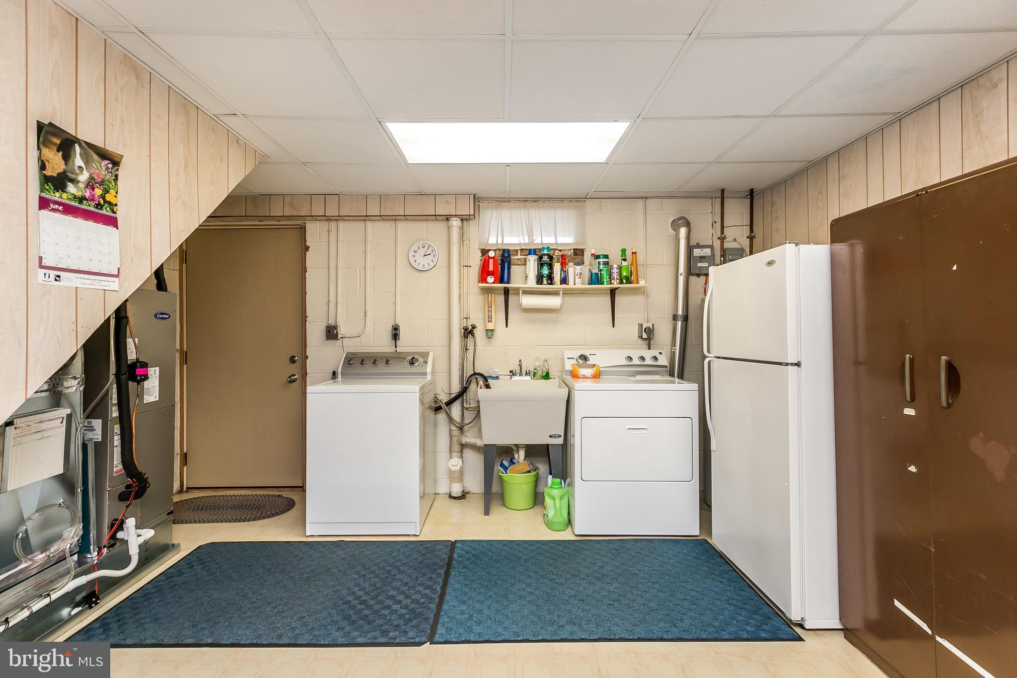 2507 Maple Road Baltimore, MD 21219 - Photo 23 of 29 a kitchen with refrigerator and cabinets
