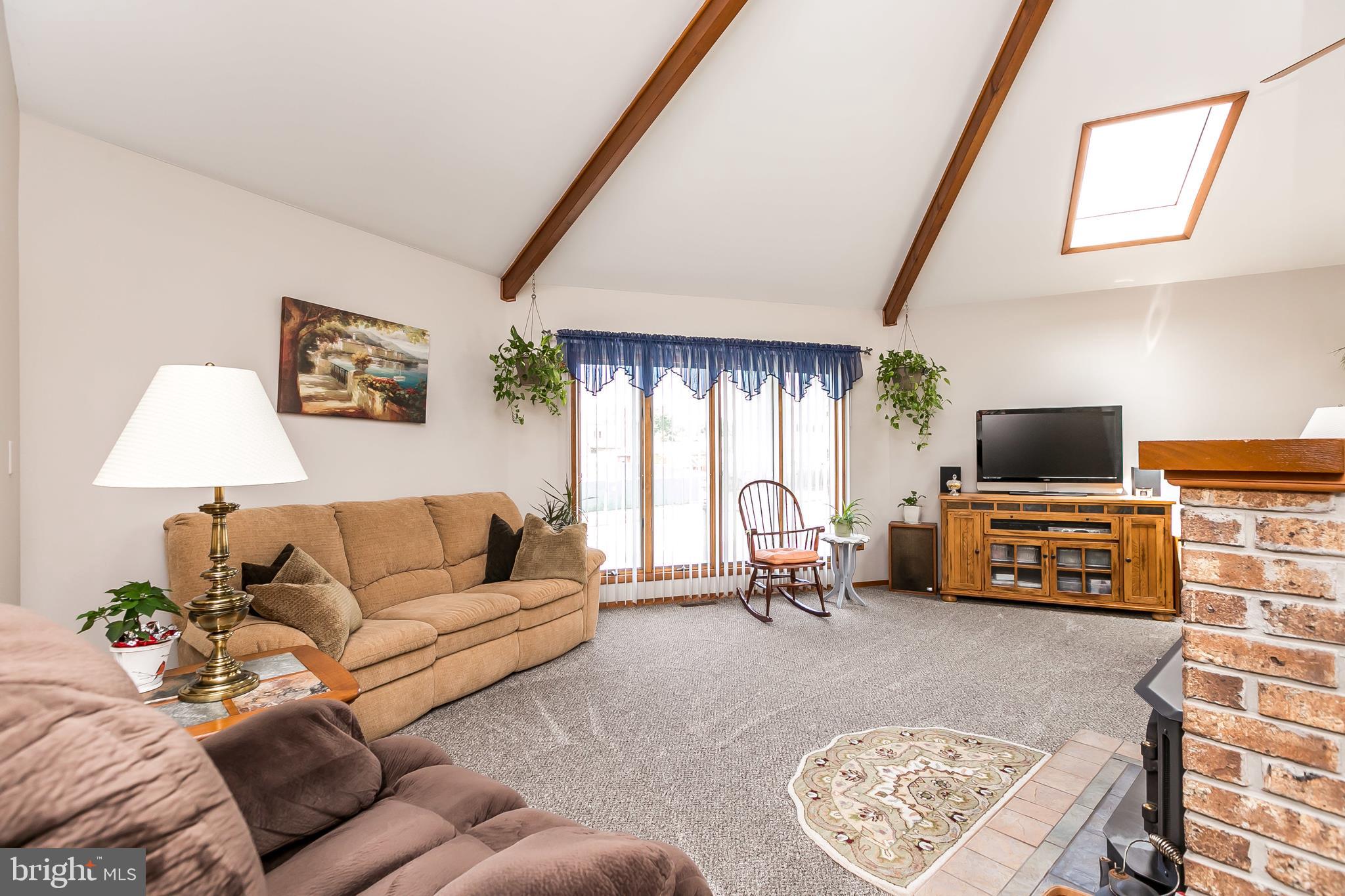 2507 Maple Road Baltimore, MD 21219 - Photo 5 of 29 a living room with furniture and a flat screen tv