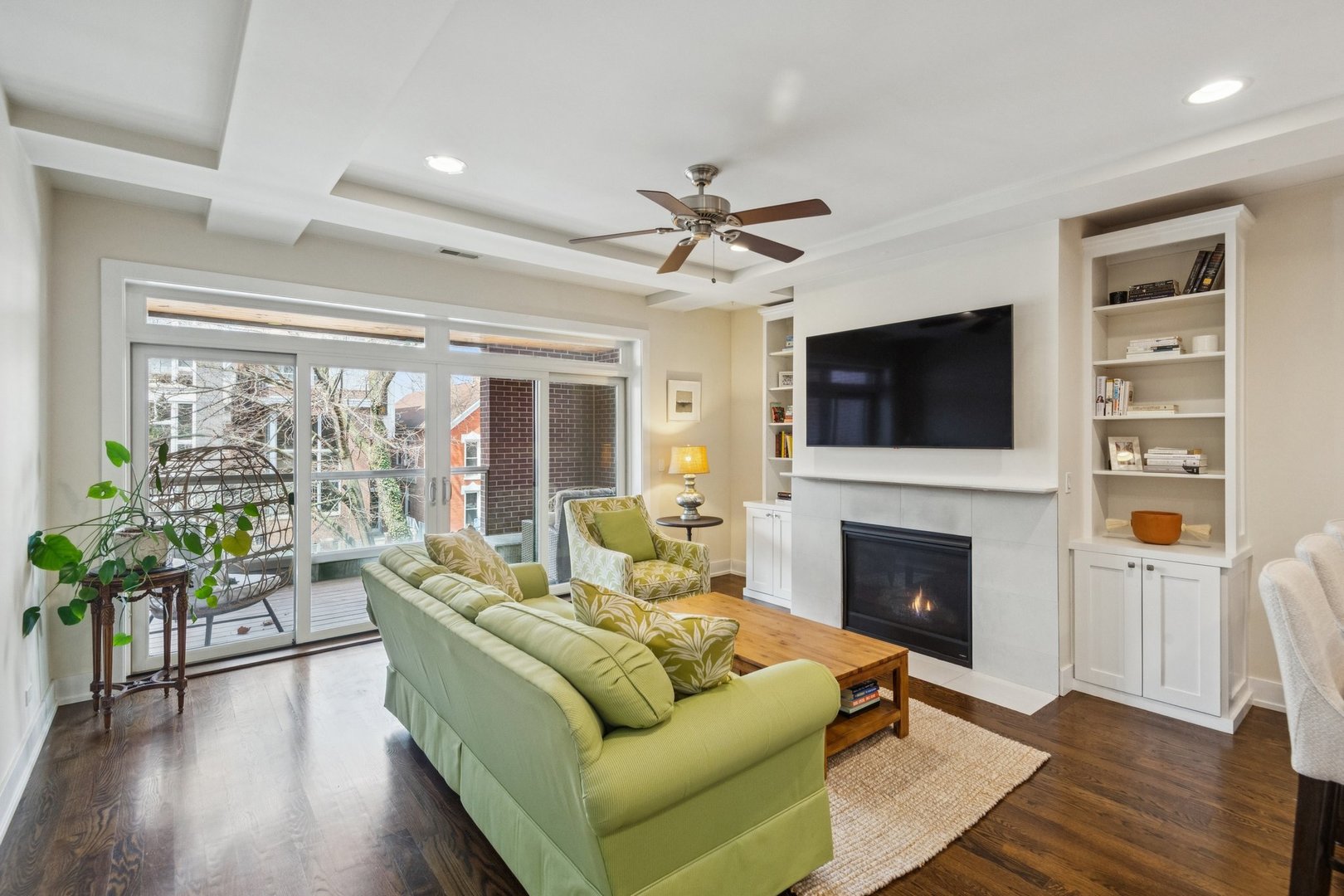 1011 North Wolcott Avenue, Unit 2N Chicago, IL 60622 - Photo 2 of 23 a living room with furniture fireplace and flat screen tv