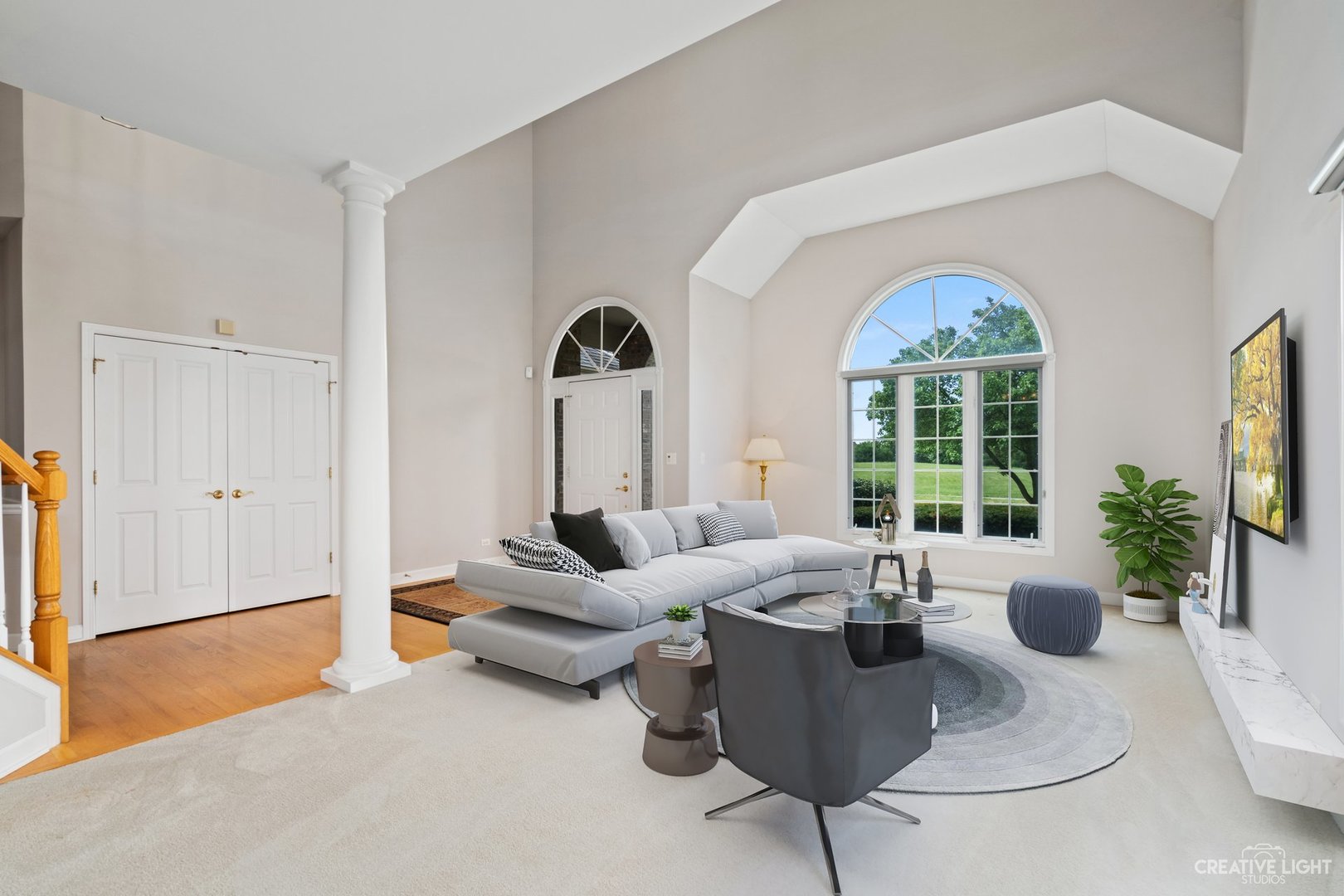 2707 Rutland Road Naperville, IL 60564 - Photo 8 of 39 a living room with furniture and a large window