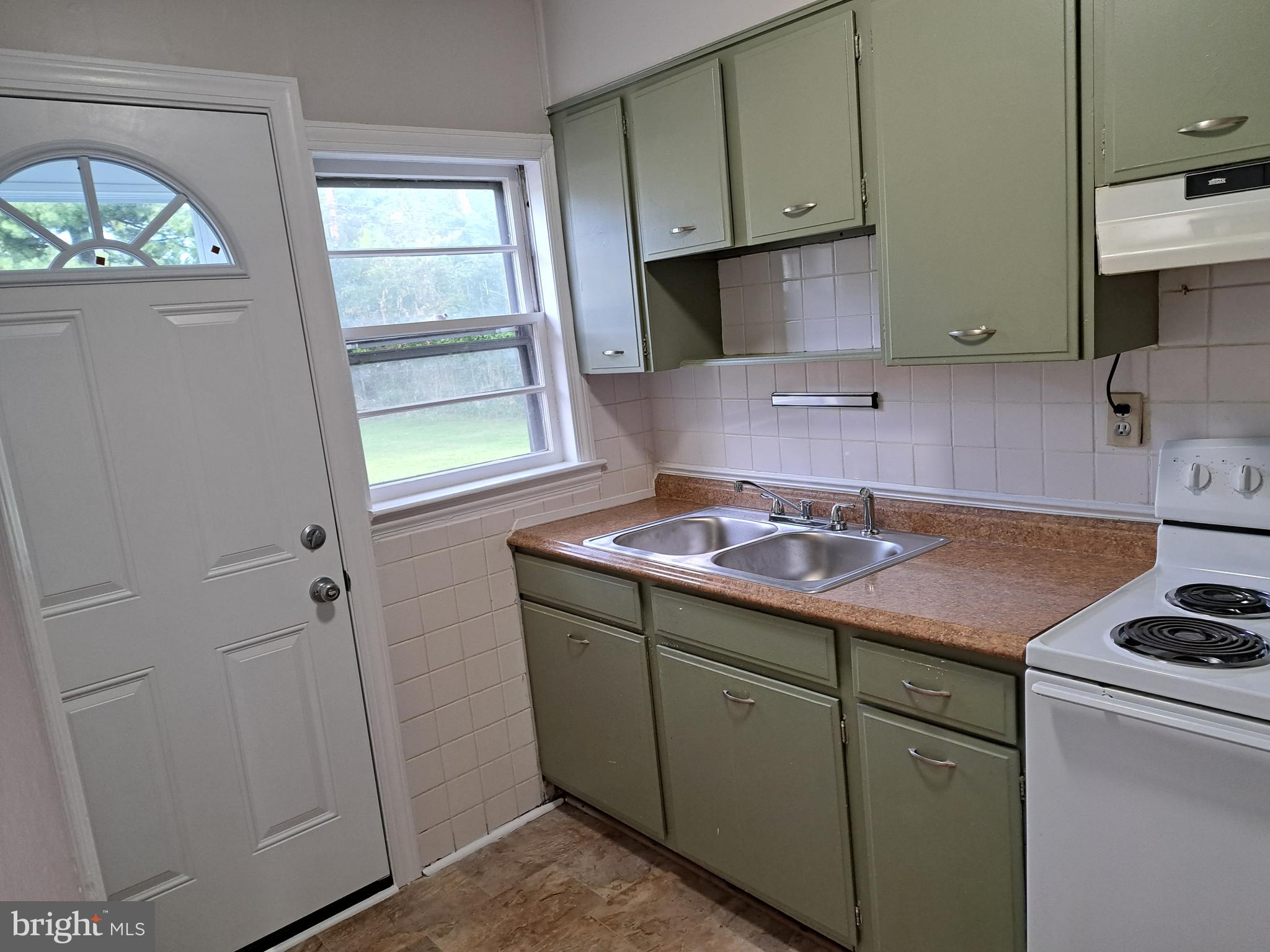 415 Biggs Avenue, Unit 1 Frederick, MD 21702 - Photo 11 of 29 a kitchen with a sink cabinets and a window