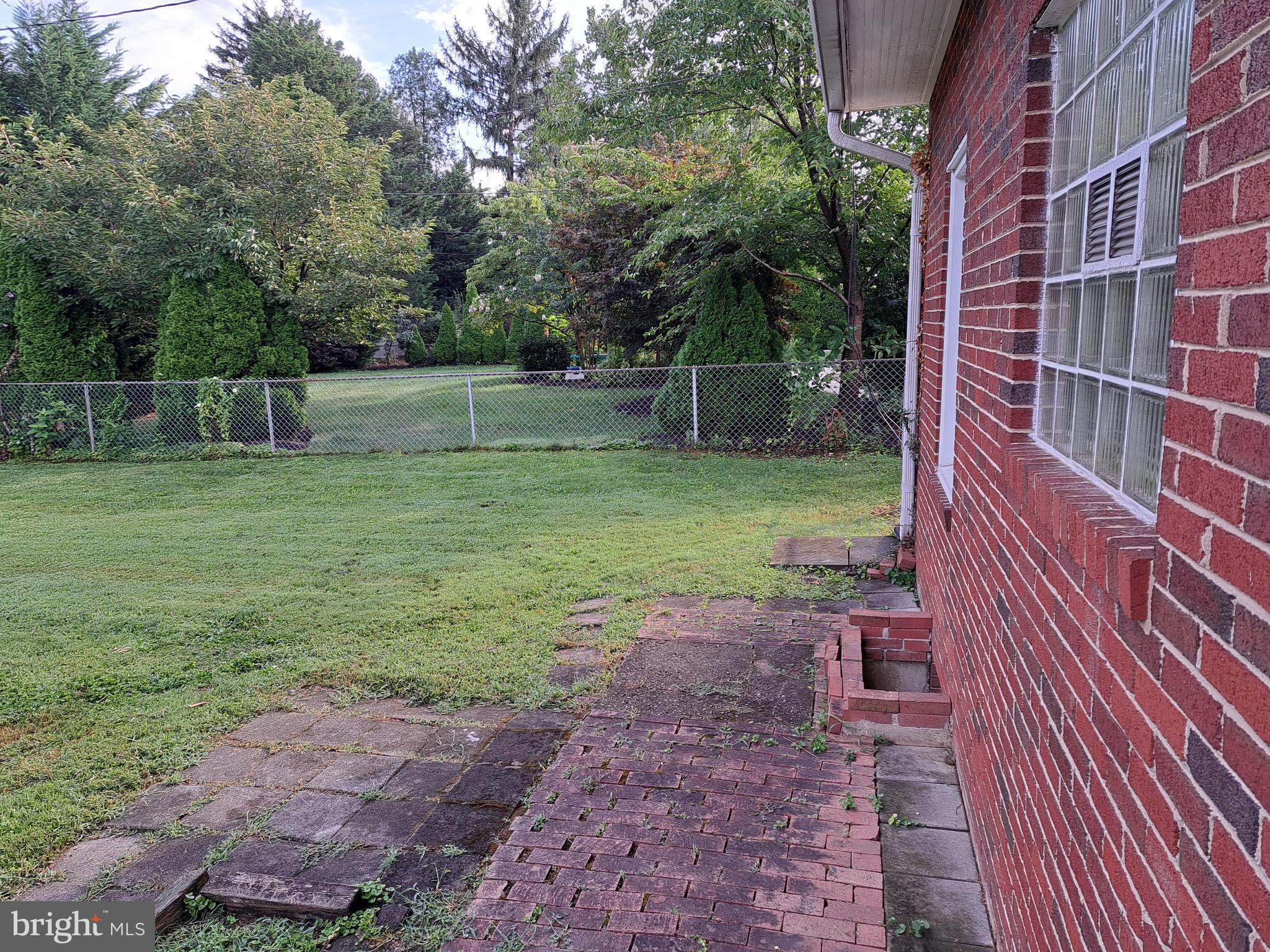 415 Biggs Avenue, Unit 1 Frederick, MD 21702 - Photo 13 of 29 a backyard of a house with lots of green space