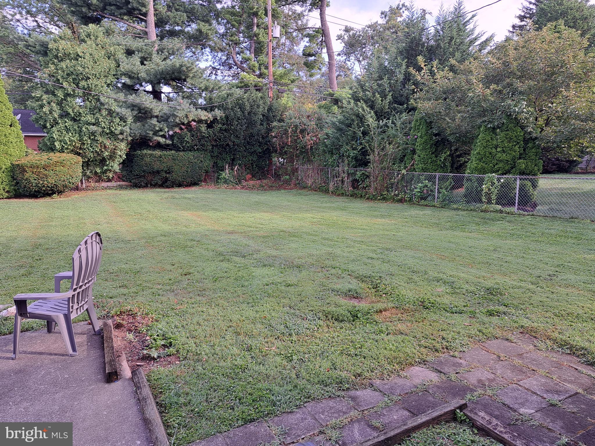 415 Biggs Avenue, Unit 1 Frederick, MD 21702 - Photo 14 of 29 a backyard of a house with table and chairs