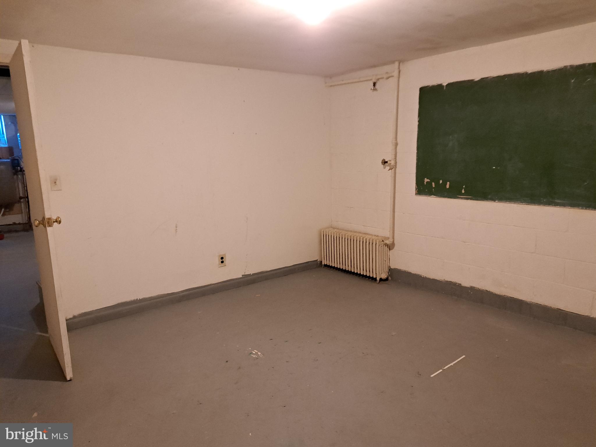 415 Biggs Avenue, Unit 1 Frederick, MD 21702 - Photo 19 of 29 a view of a room with wooden floor and cabinet