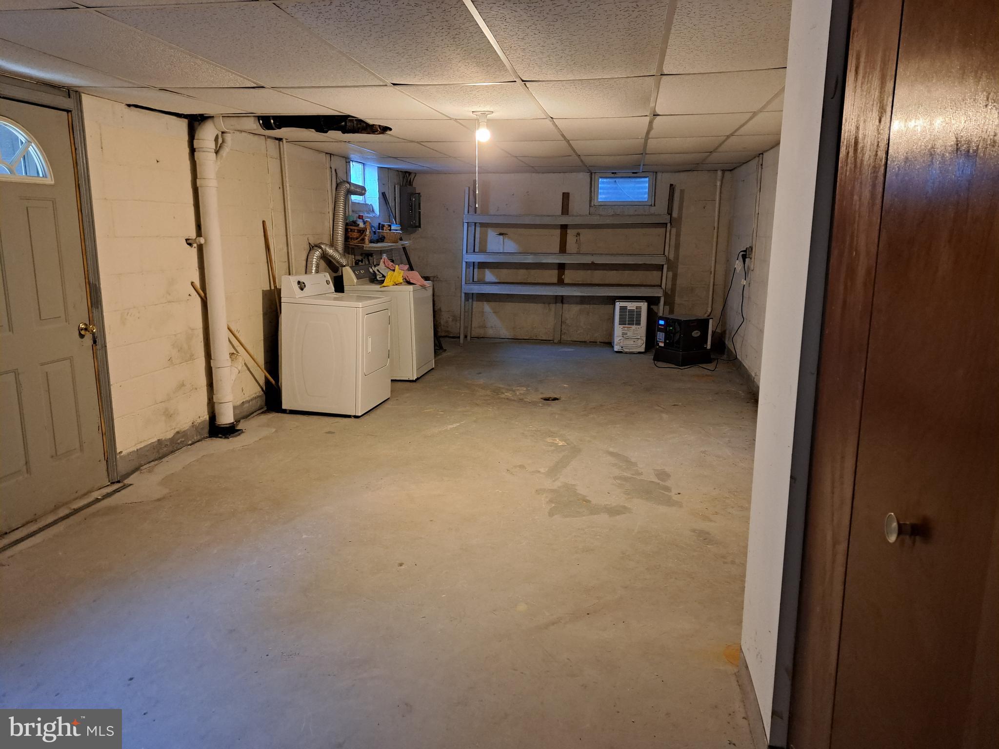 415 Biggs Avenue, Unit 1 Frederick, MD 21702 - Photo 23 of 29 a view of storage and utility room with stairs