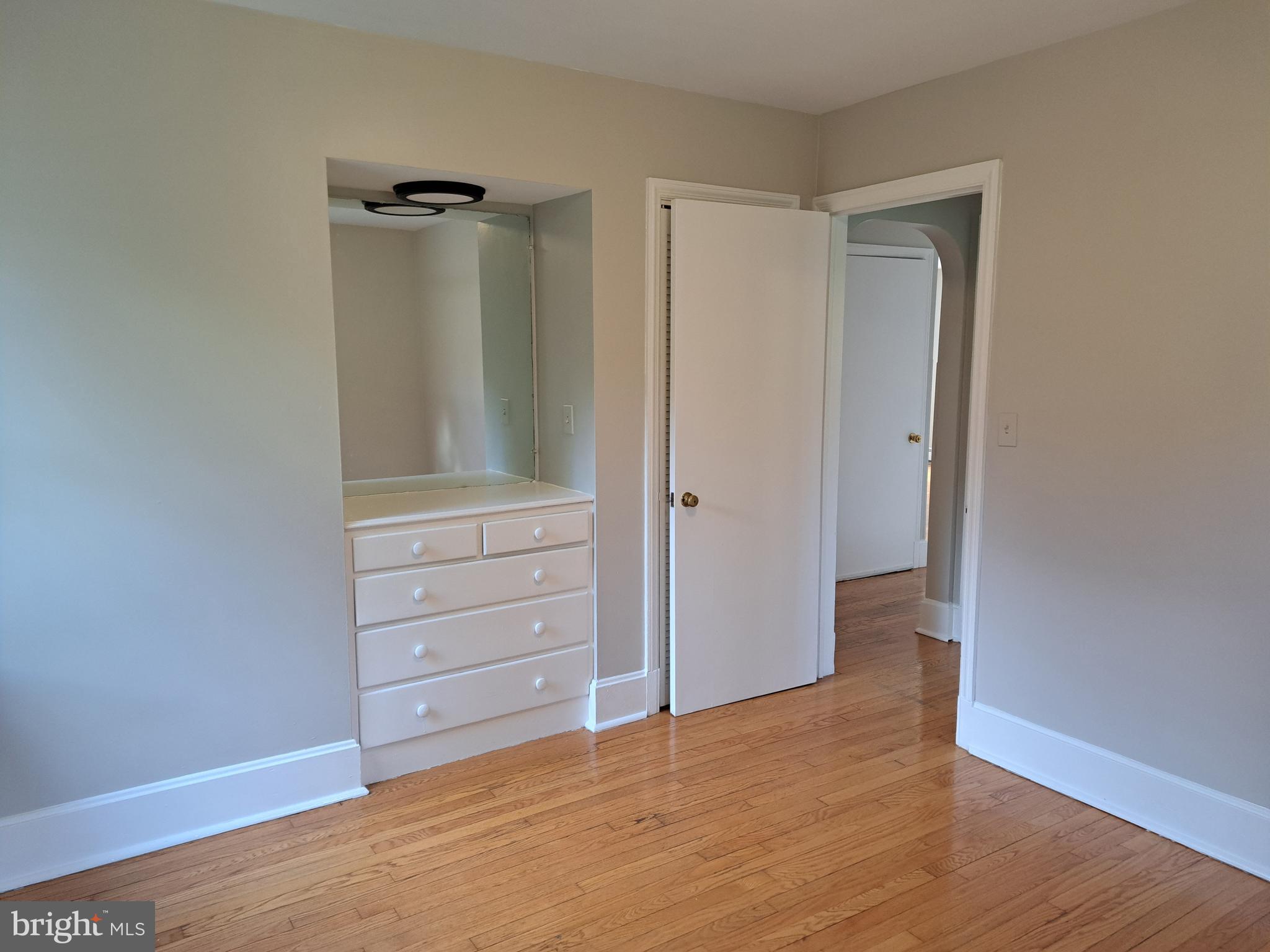 415 Biggs Avenue, Unit 1 Frederick, MD 21702 - Photo 8 of 29 wooden floor in an empty room
