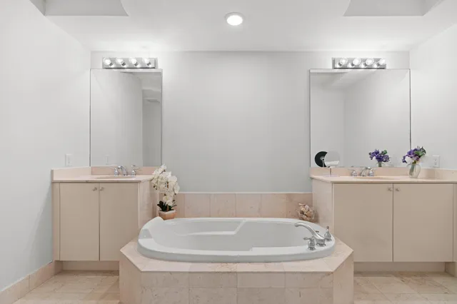 a bathroom with a tub and sink