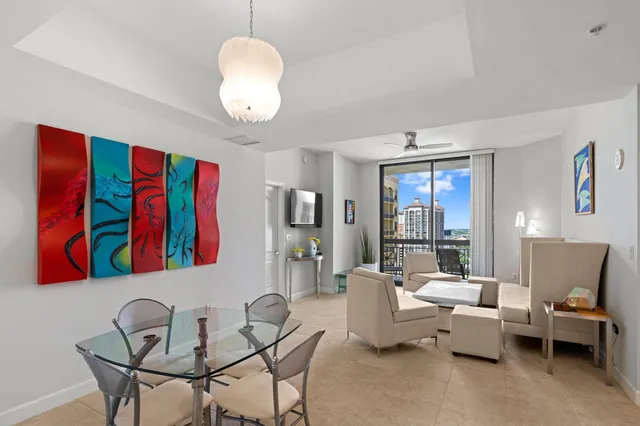 a living room with furniture and a large mirror