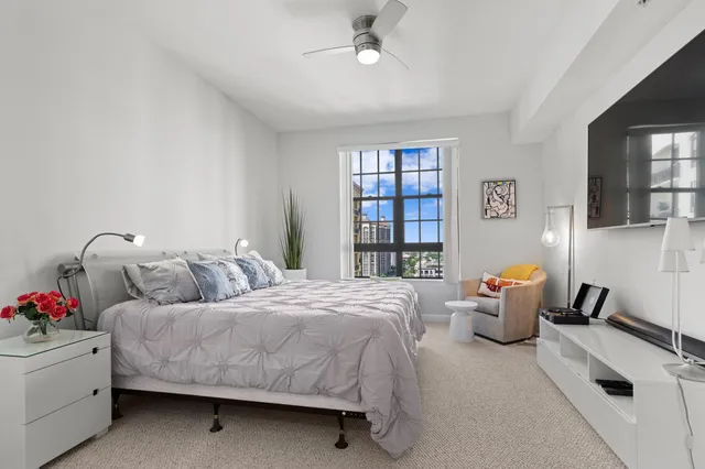 a bedroom with bed and window