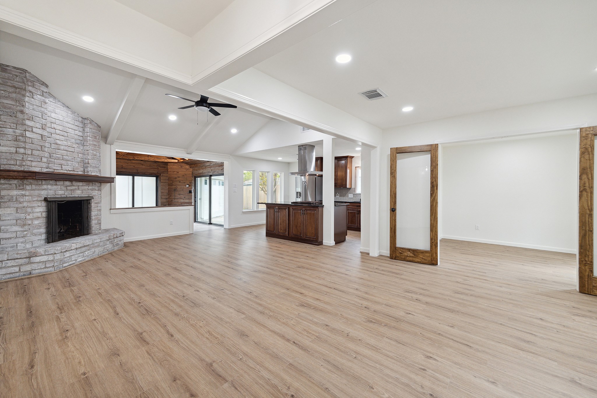 9719 Springmont Drive Houston, TX 77080 - Photo 4 of 32 Welcome Home! This view emphasizes the open-concept layout! Central living room opens to dining room, kitchen, breakfast nook, sunroom, and even the bonus room! Great flexibility for furniture placement!