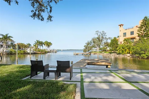 a view of a lake with outdoor seating space