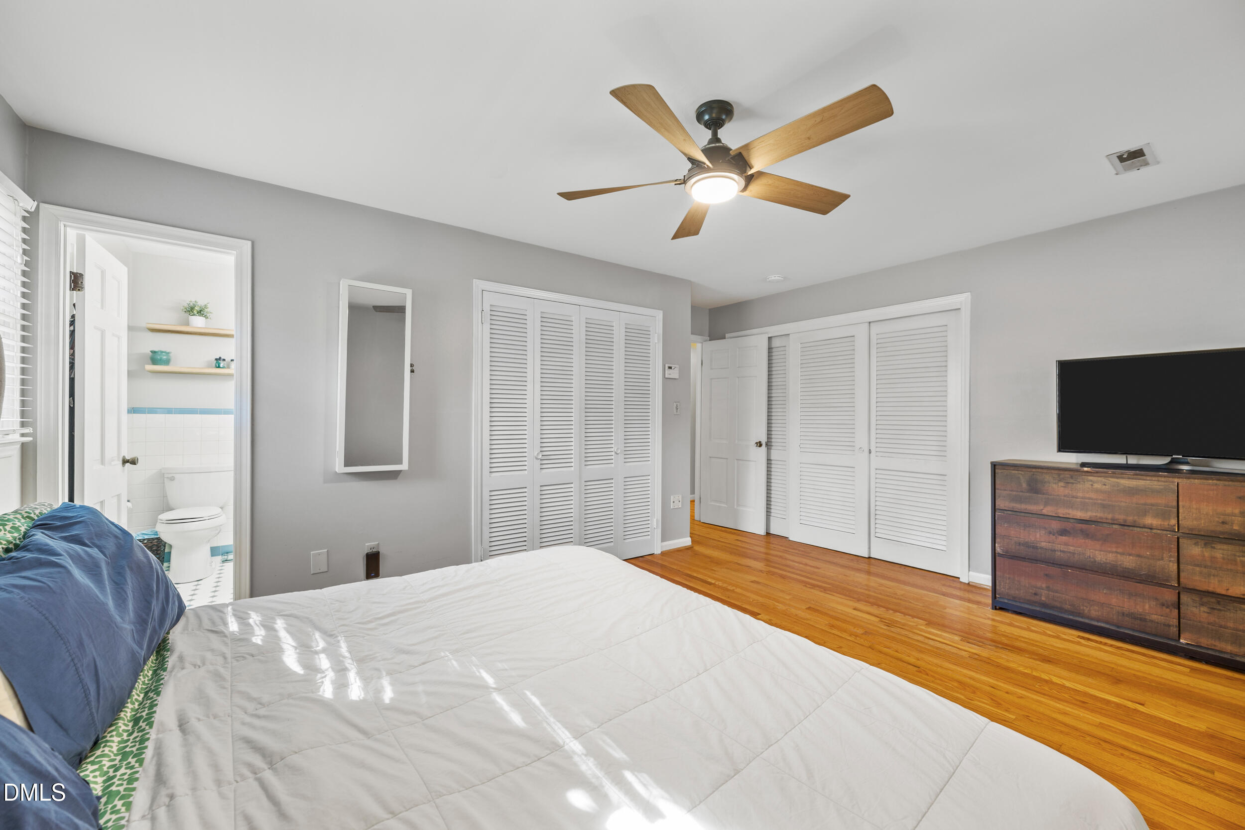 3726 Swift Drive Raleigh, NC 27606 - Photo 20 of 40 a bedroom with a bed and a flat screen tv