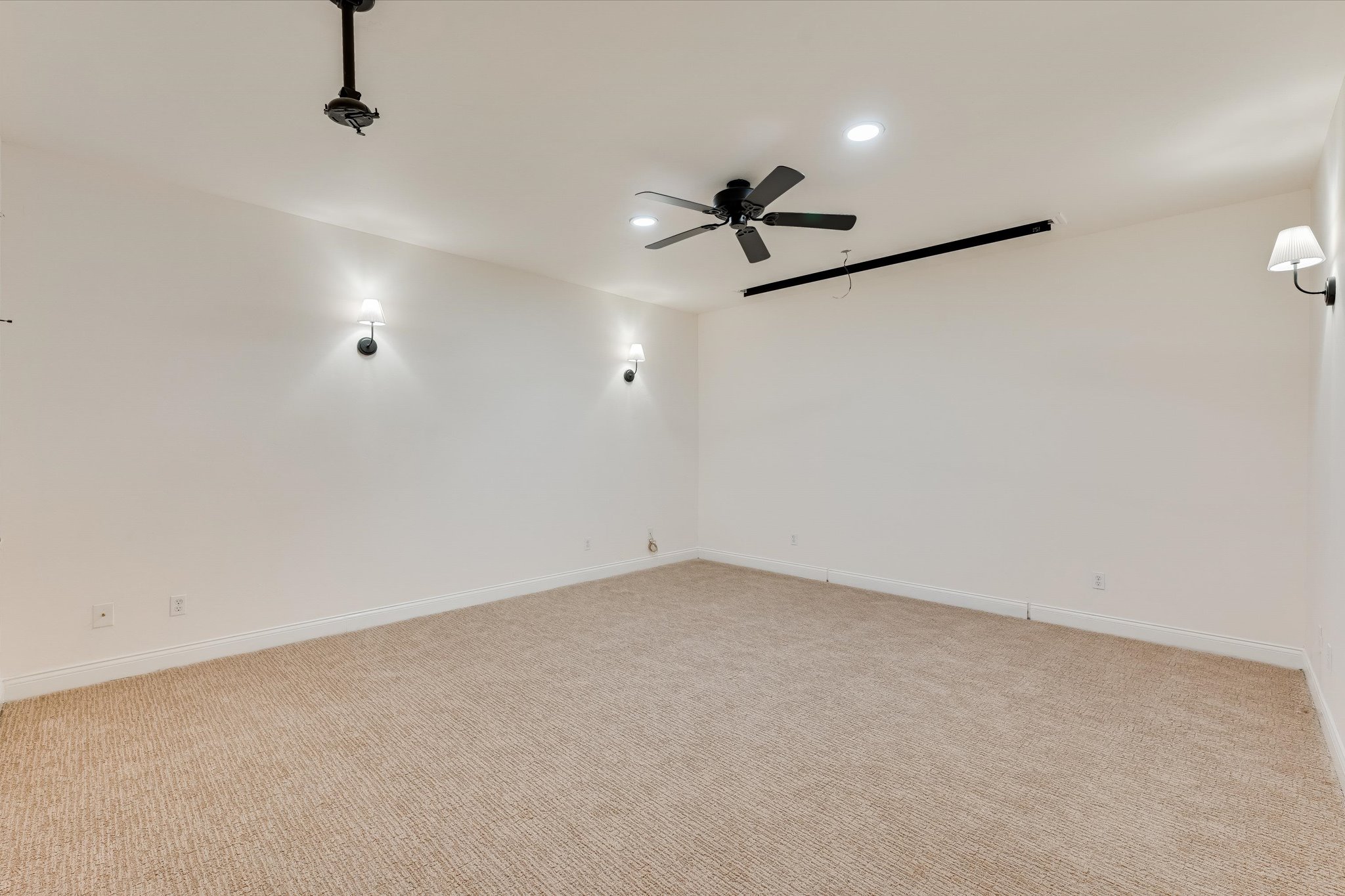 4319 Rum Runner Road Austin, TX 78734 - Photo 35 of 40 Unfurnished room featuring light carpet, recessed lighting, and a ceiling fan