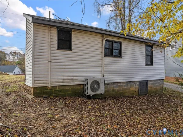 a side view of a house with a yard