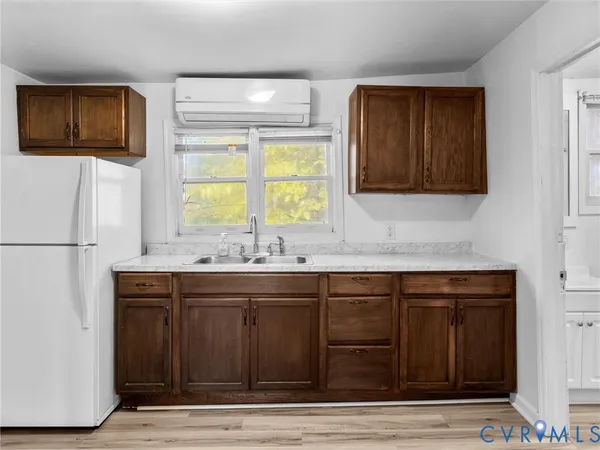 a kitchen with stainless steel appliances granite countertop a sink and a microwave