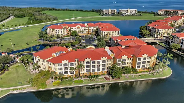 an outdoor view of a building with lake view