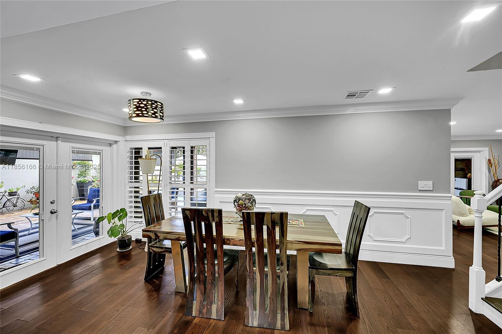 9398 Aegean Drive Boca Raton, FL 33496 - Photo 11 of 61 a view of a a dining room with furniture window and wooden floor