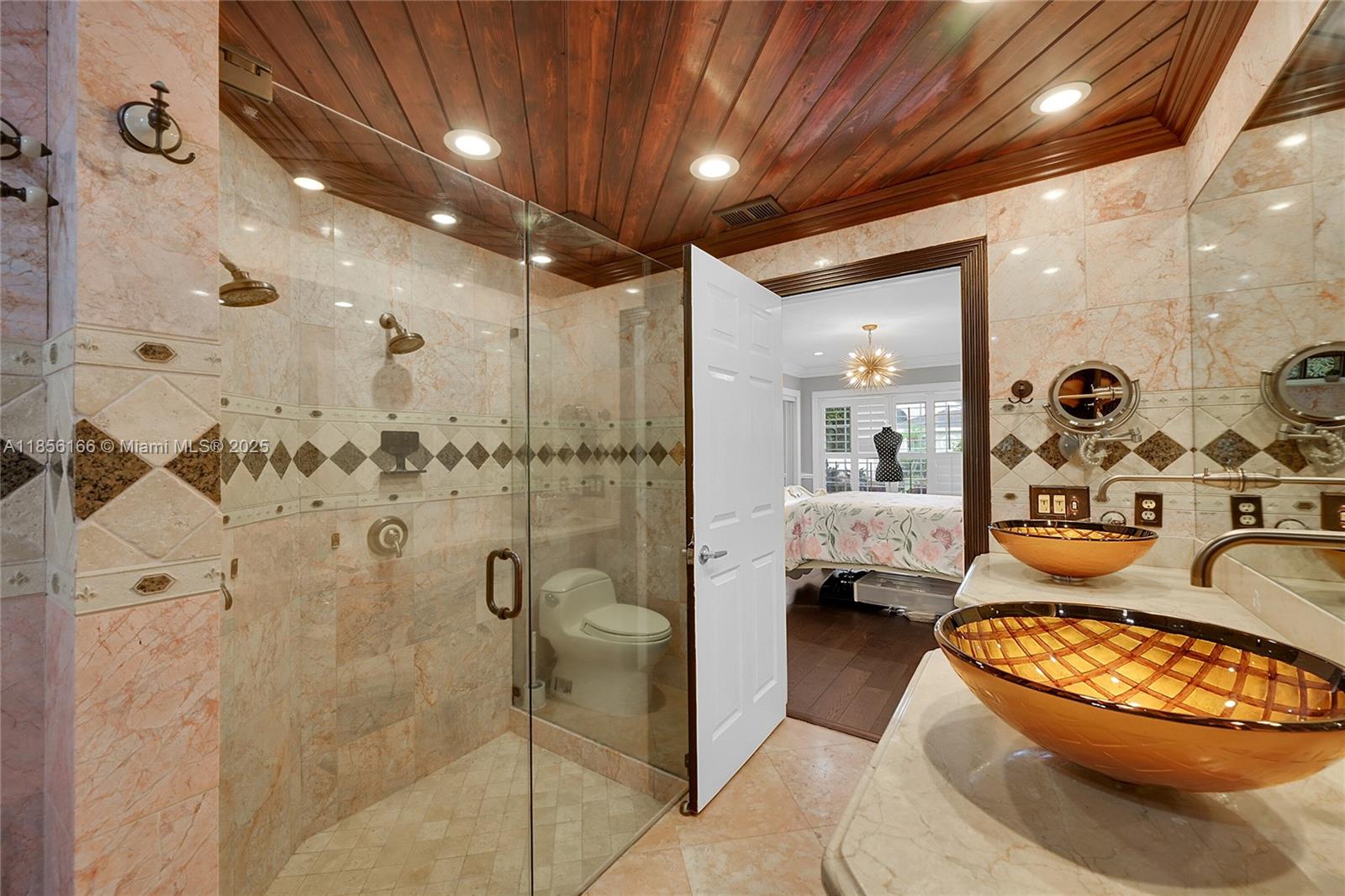 9398 Aegean Drive Boca Raton, FL 33496 - Photo 26 of 61 a bathroom with a granite countertop sink a toilet and shower