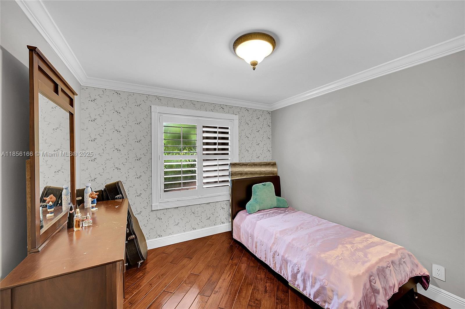 9398 Aegean Drive Boca Raton, FL 33496 - Photo 31 of 61 a bedroom with a bed and wooden floor