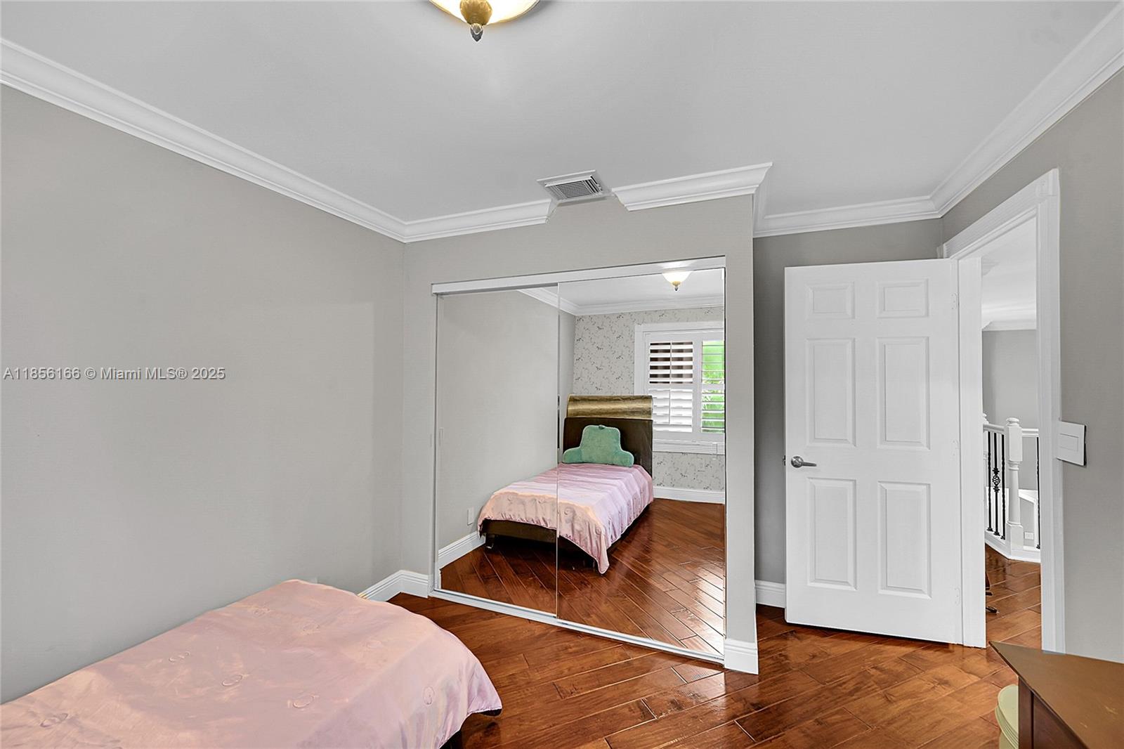 9398 Aegean Drive Boca Raton, FL 33496 - Photo 32 of 61 a bedroom with a bed and a chandelier