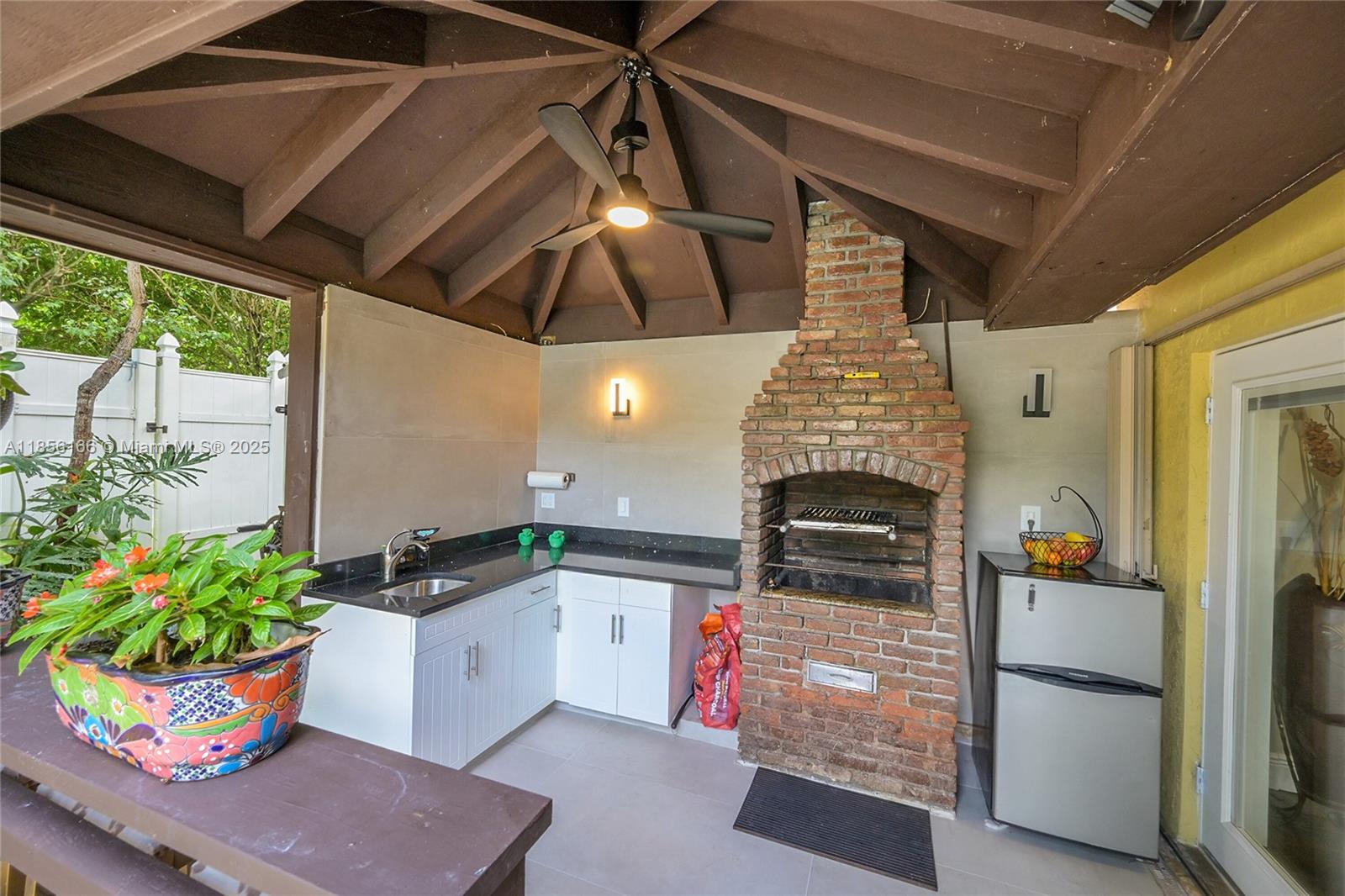 9398 Aegean Drive Boca Raton, FL 33496 - Photo 39 of 61 a kitchen with a stove and a refrigerator