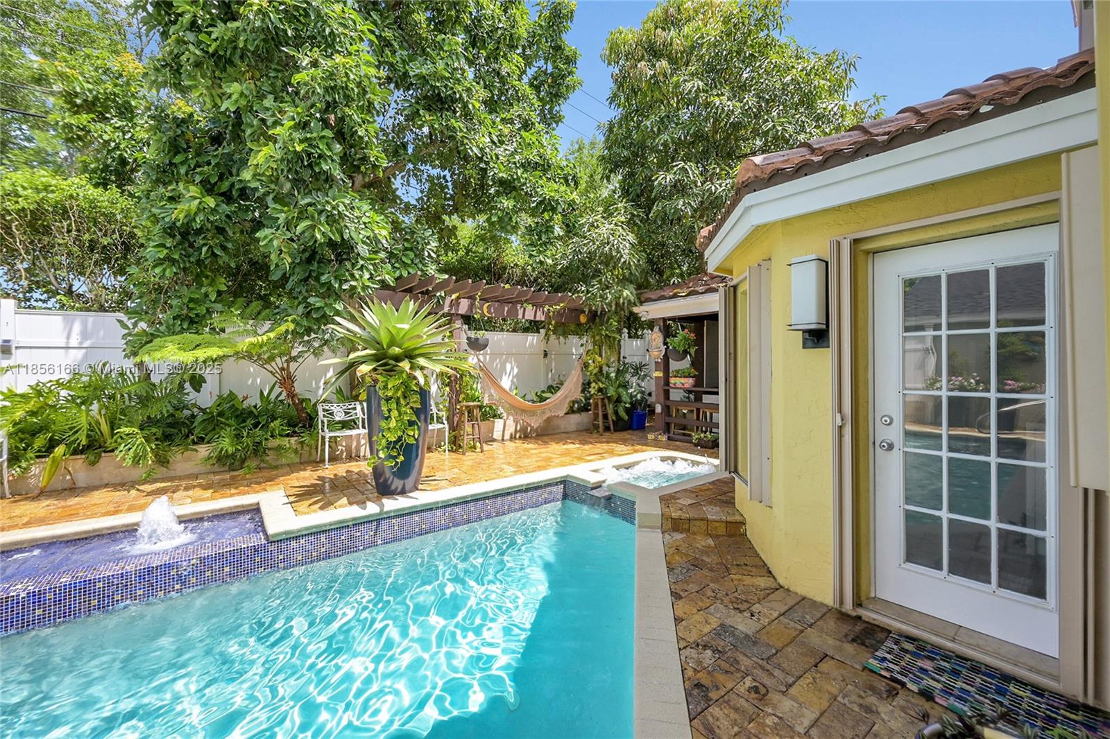 9398 Aegean Drive Boca Raton, FL 33496 - Photo 45 of 61 a view of a house with backyard and sitting area