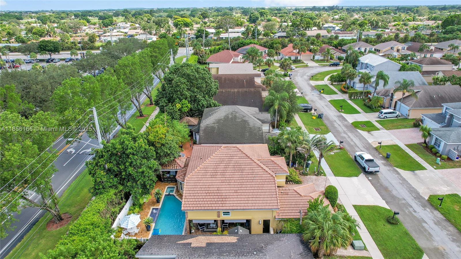 9398 Aegean Drive Boca Raton, FL 33496 - Photo 56 of 61 an aerial view of multiple houses with yard